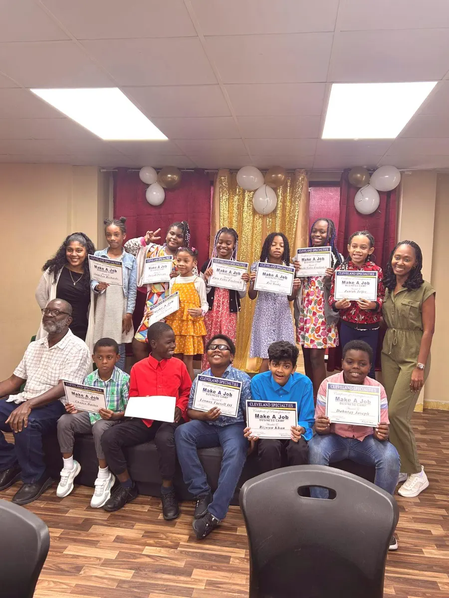 Graduates proudly holding their Make a Job certificates
