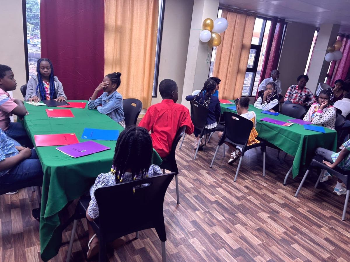 Campers working together on their business plans