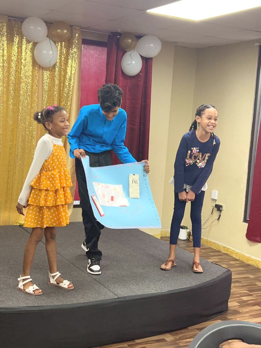 Campers sharing their business pitch on stage